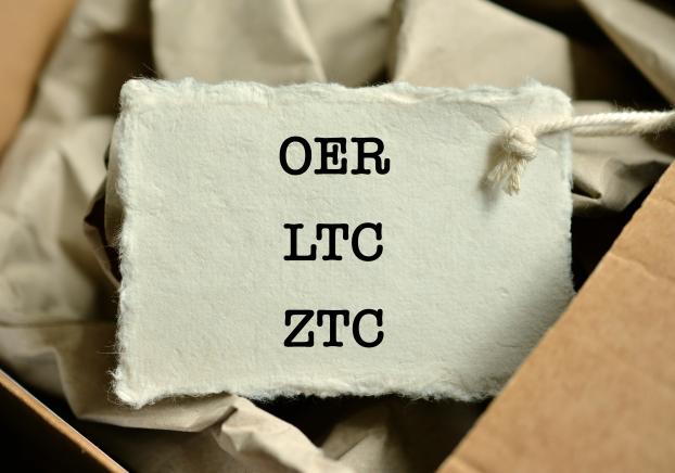 A paper tag in a box. Tag states "OER," "LTC," and "ZTC"